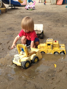 Playing in the wet sand puddles after the storm.